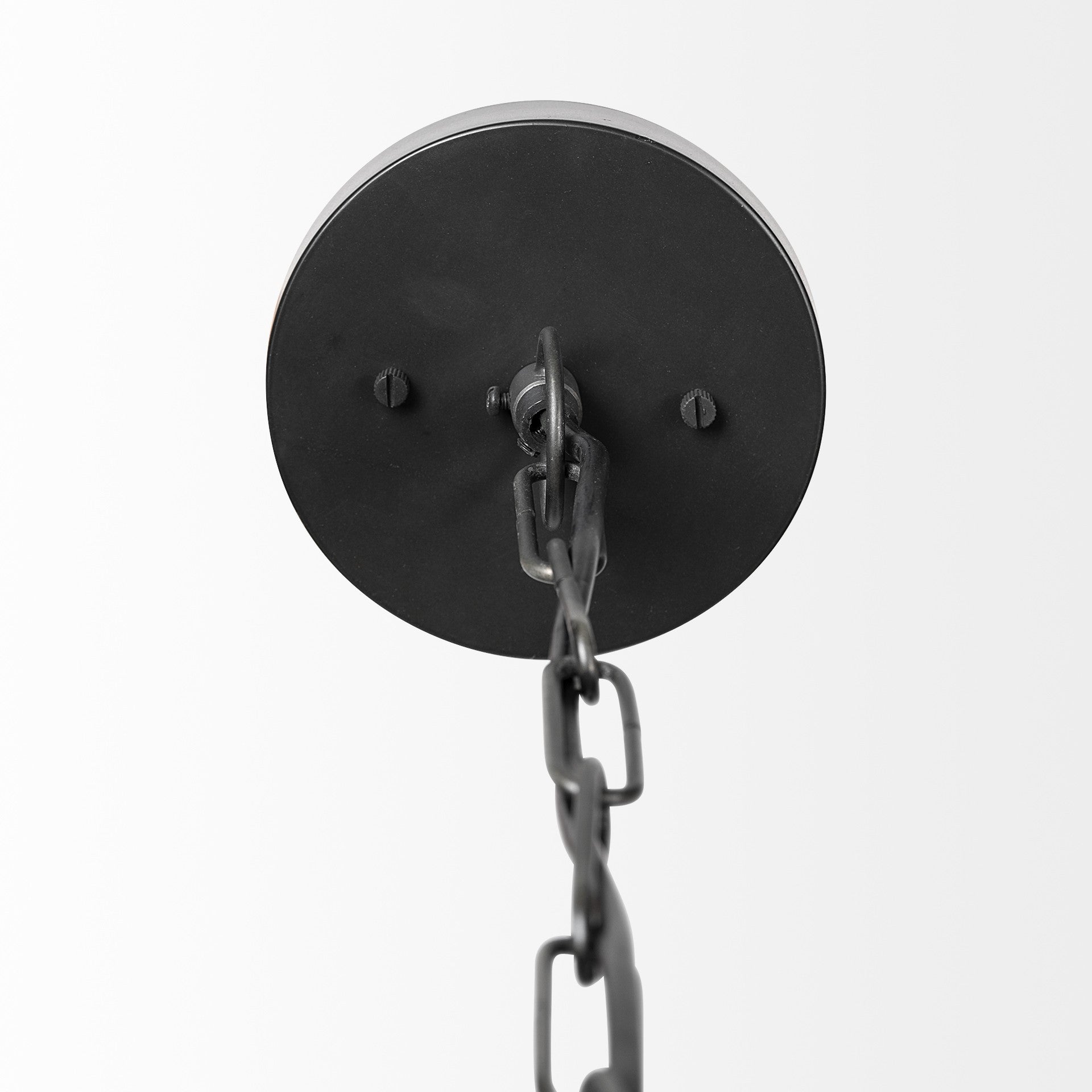 Black metal wall sconce with chain on a white background