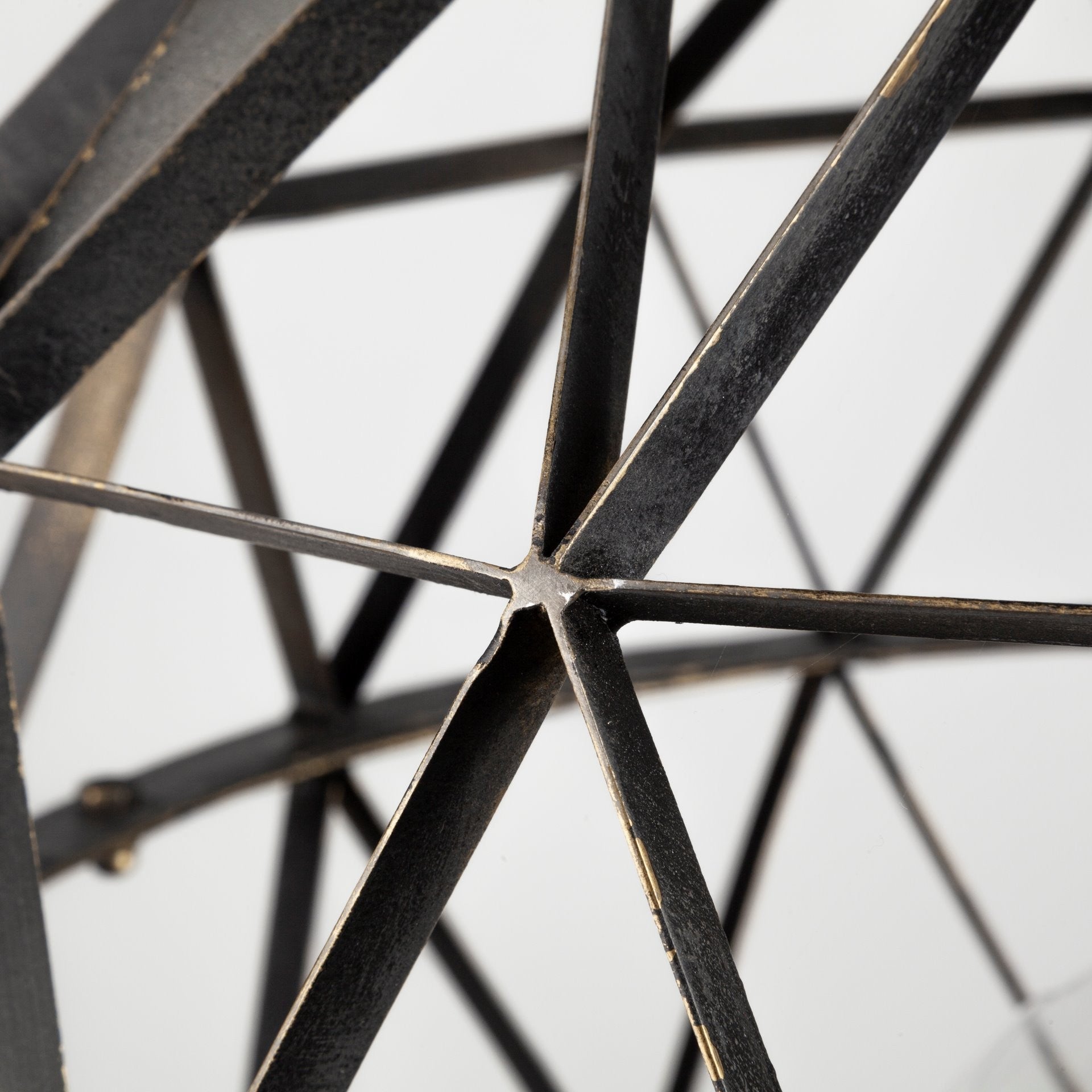 Close-up of a metal star-shaped object on a light background