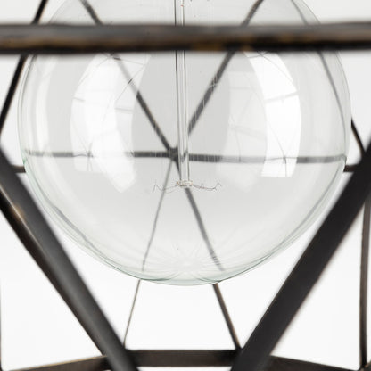 Close-up of a clear glass sphere with metal frame on a white background