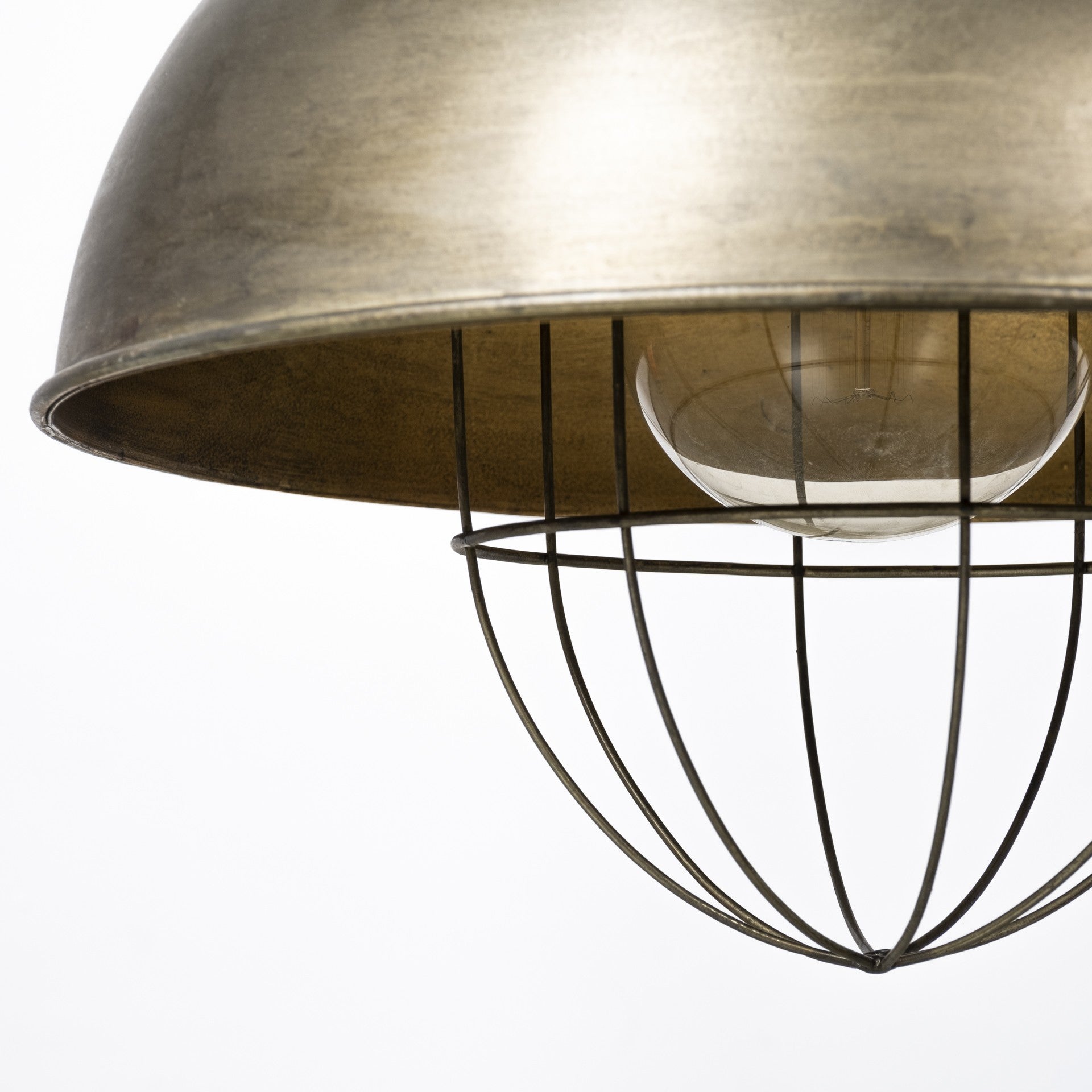 Close-up of a metallic pendant light with a white bulb on a white background