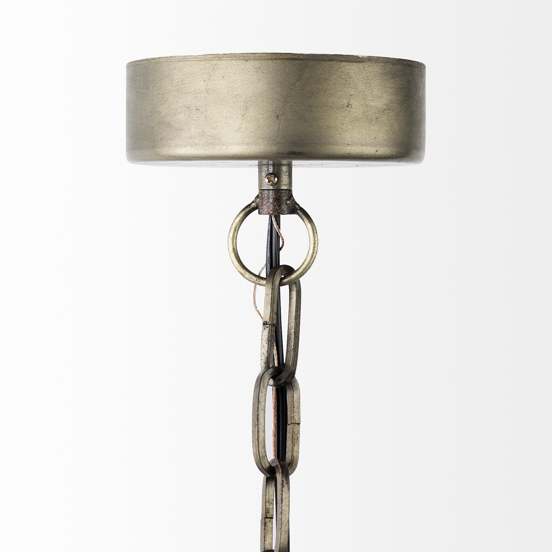 Decorative lamp with metallic shade and chain on a white background