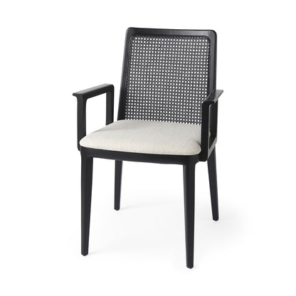 Black armchair with woven backrest and white cushion on a white background