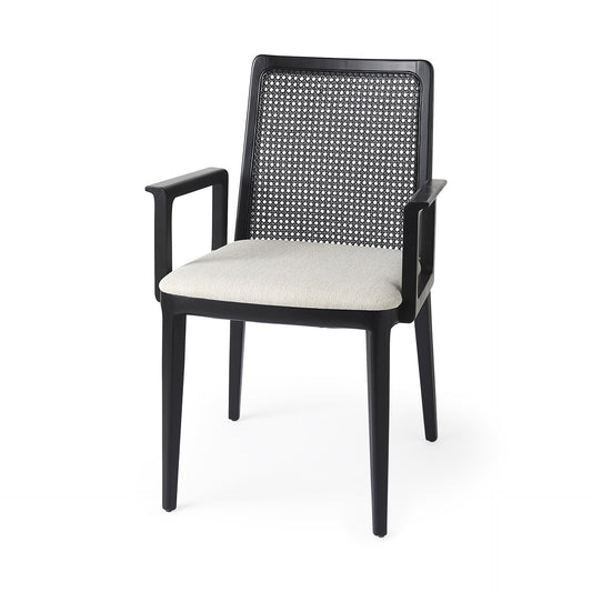 Black armchair with woven backrest and white cushion on a white background