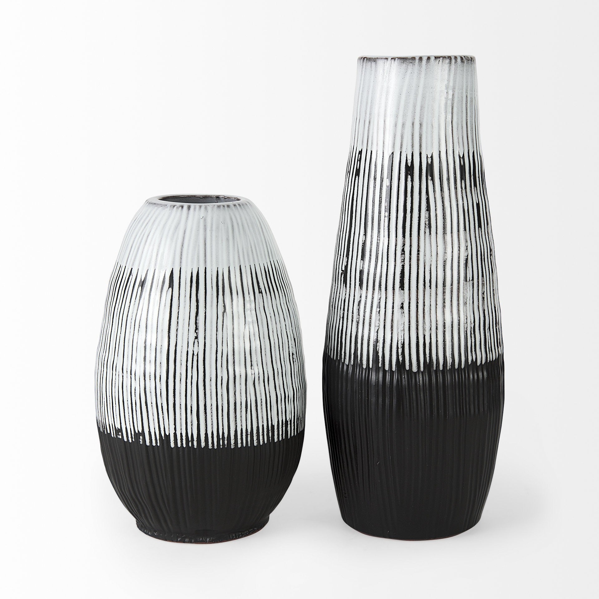Two black and white patterned vases on a white background