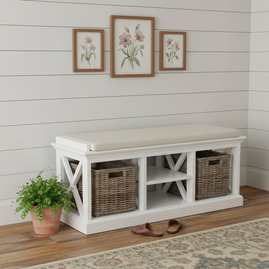 White storage bench with wicker baskets against a white wall with floral artwork.