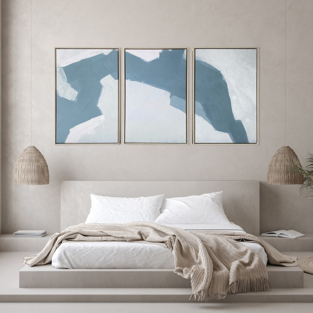 Bedroom with abstract wall art above a bed