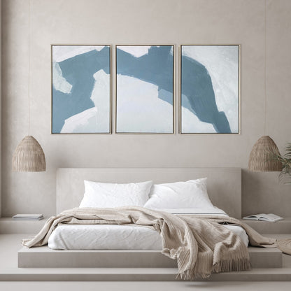 Bedroom with abstract wall art above a bed