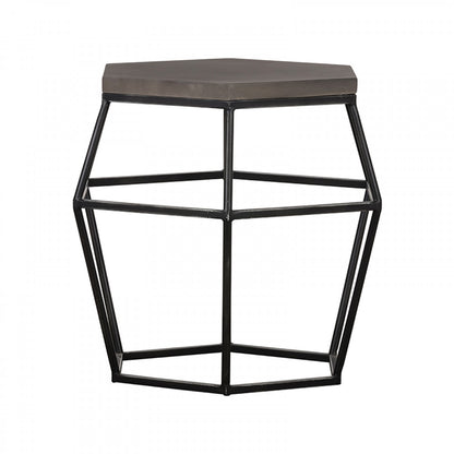 Hexagonal side table with geometric metal frame and concrete top on a white background