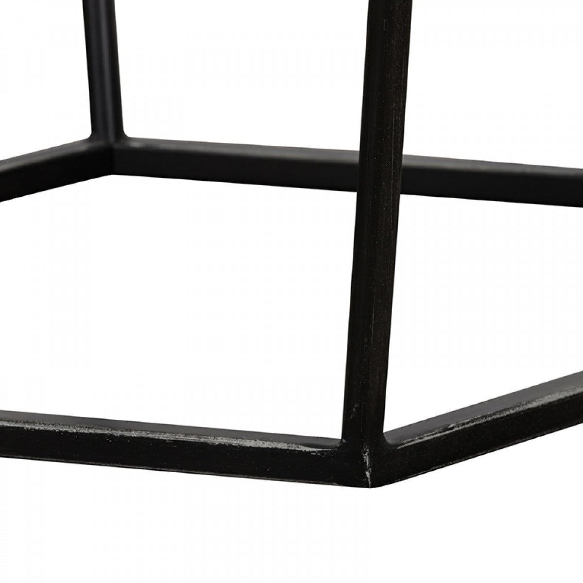 Close-up of a black metal chair frame on a white background