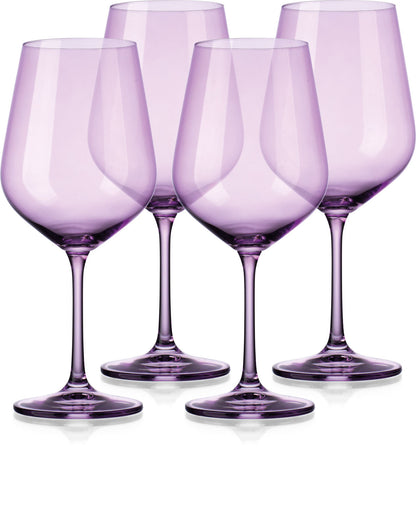 Four purple wine glasses on a white background