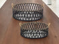 SET OF TWO BLACK AND TAN ROUND BAMBOO SERVING TRAY WITH HANDLES - Varnish & Vibe
