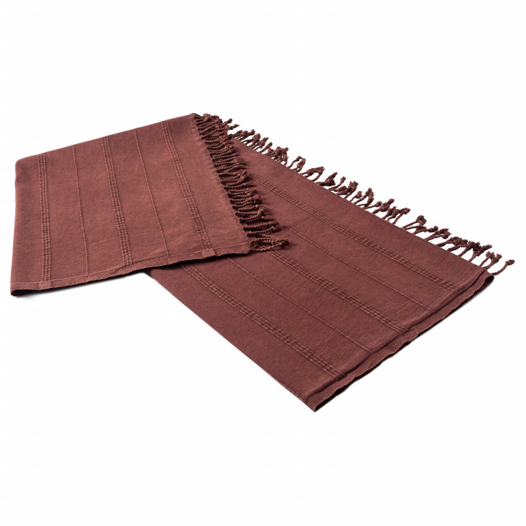 Brown fabric with fringes on a white background