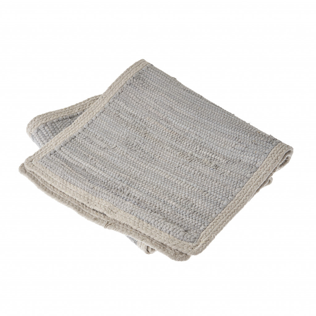 Two gray textured cloths stacked on a white background