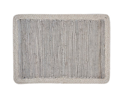 Gray textured bath mat on a white background