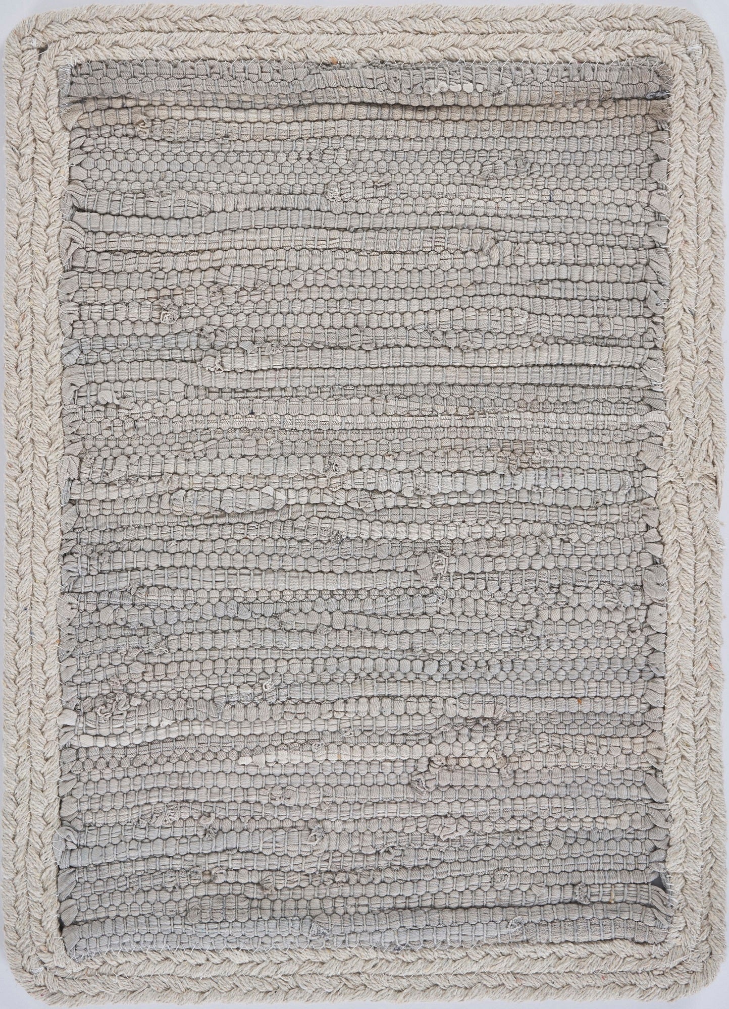 Textured gray rug on a white background