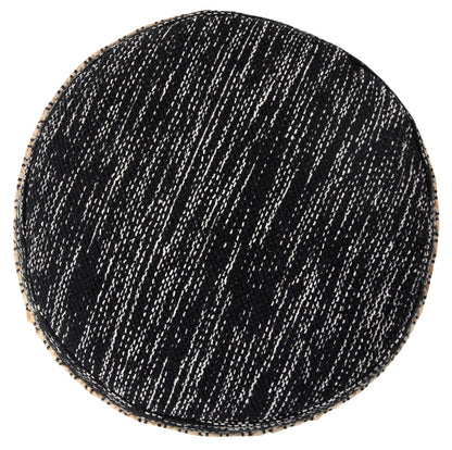 Round black rug with white speckles on a white background