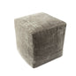 Textured cube-shaped ottoman on a white background