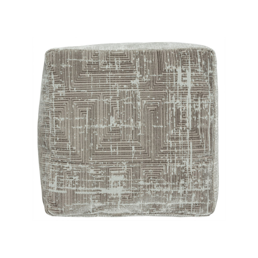 Textured square pillow with geometric pattern on a white background