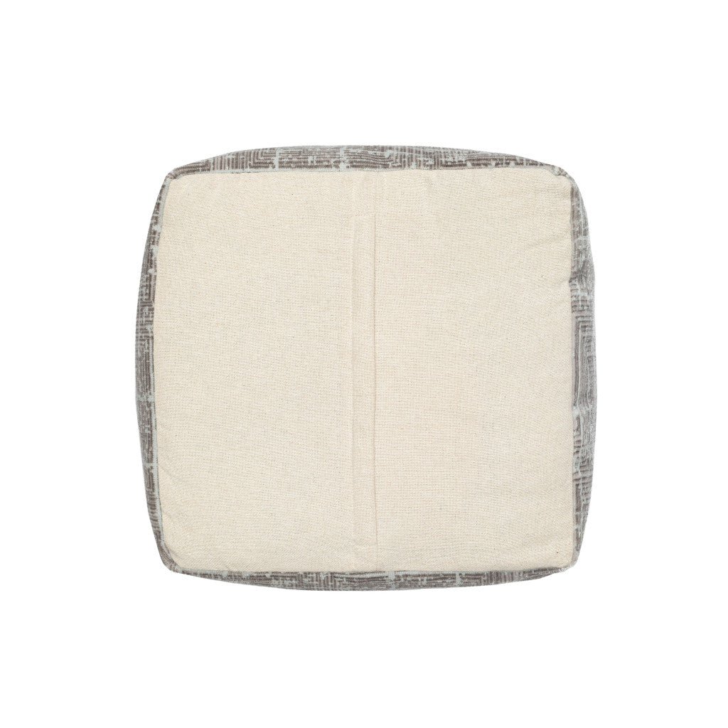 Square ottoman with a textured surface on a white background