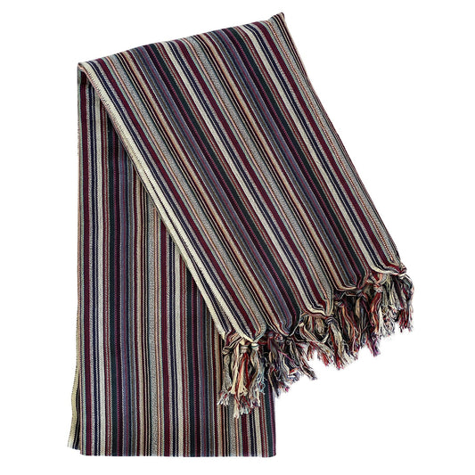 Striped blanket with tassels on a white background
