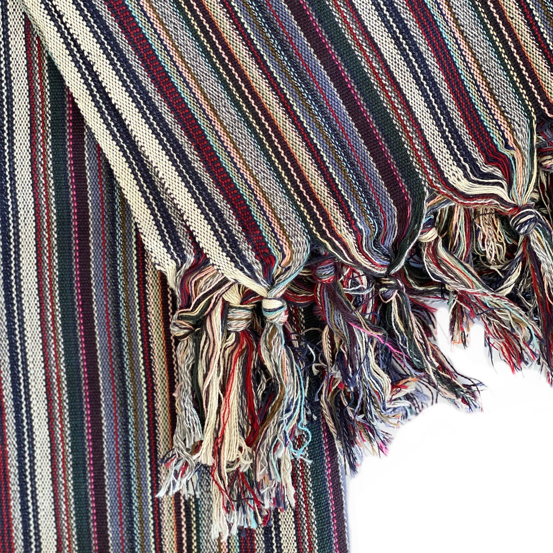 Striped fabric with tassels on a white background