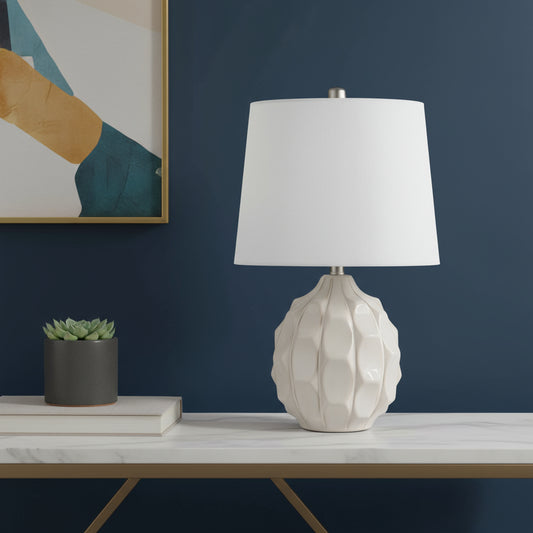 22" CREAM CERAMIC FACETED TABLE LAMP WITH OFF WHITE DRUM SHADE