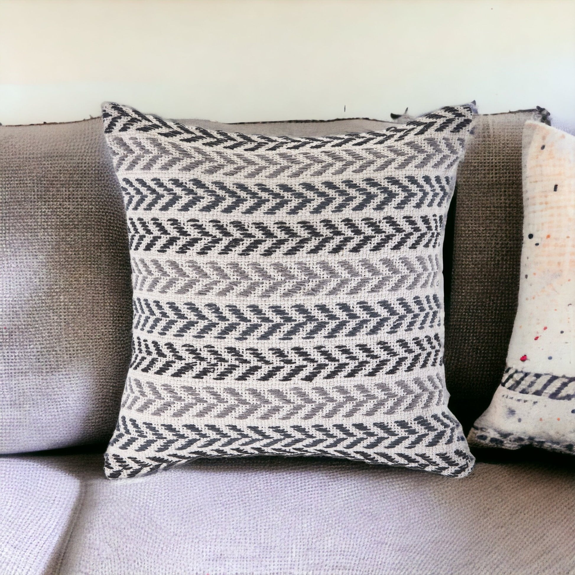 Patterned pillow on a sofa with a neutral background
