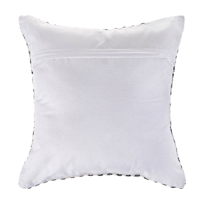 White pillow with black trim on a white background