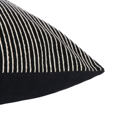Black pillow with white stripes on a white background