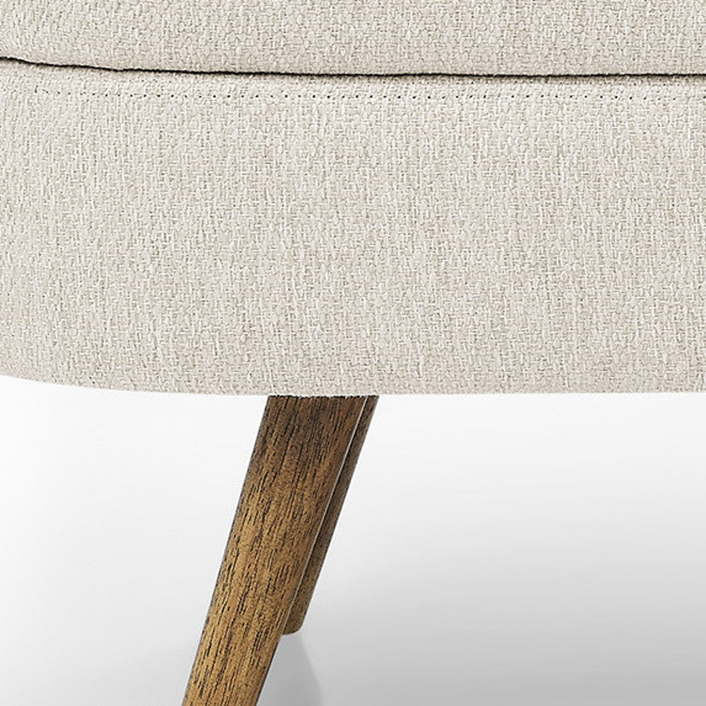Detail of the splayed wood legs on the linen storage bench