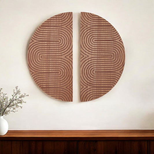 Two circular wooden wall art pieces with wavy line patterns on a white wall.