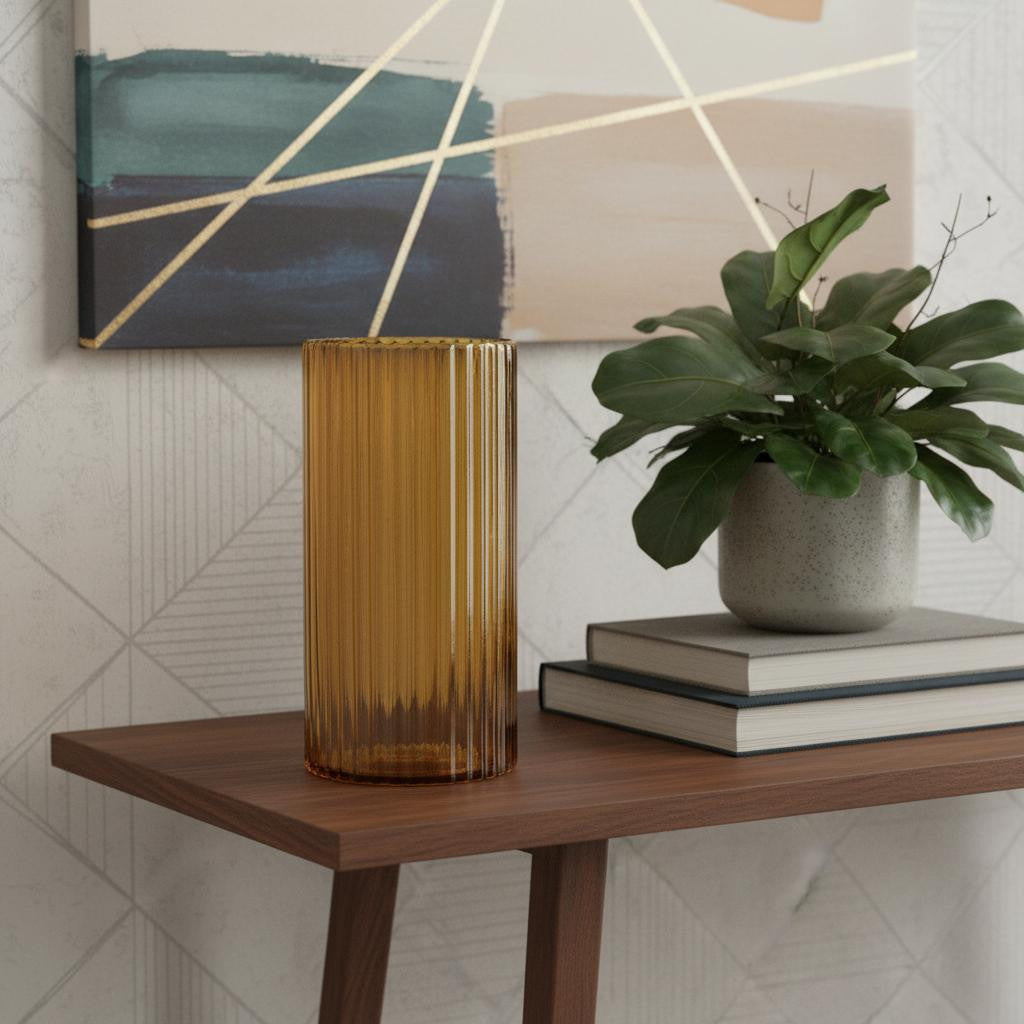 Palisades amber glass cylinder vase styled on a dark wood console
