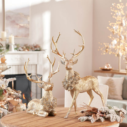 SET OF TWO GOLD AND GRAY REINDEER FIGURINES