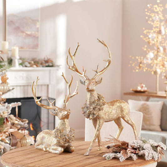 SET OF TWO GOLD AND GRAY REINDEER FIGURINES