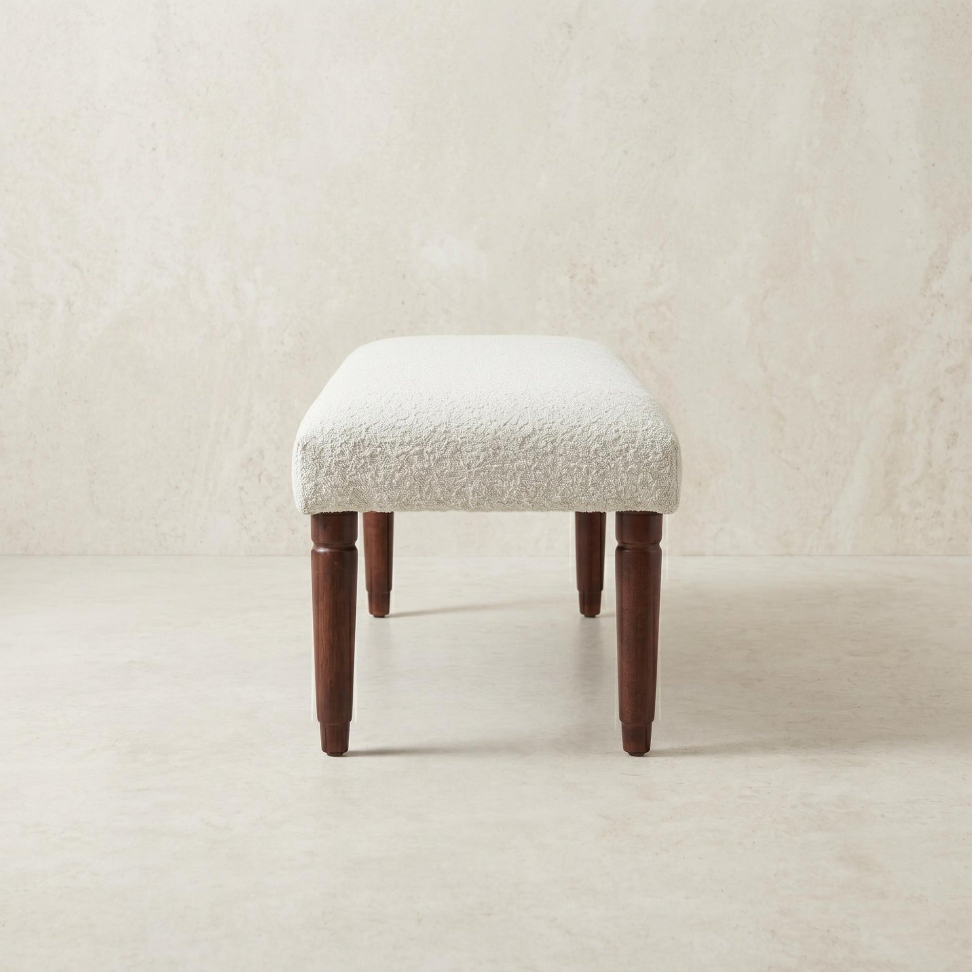 Side view of the 47-inch cream boucle upholstered bench