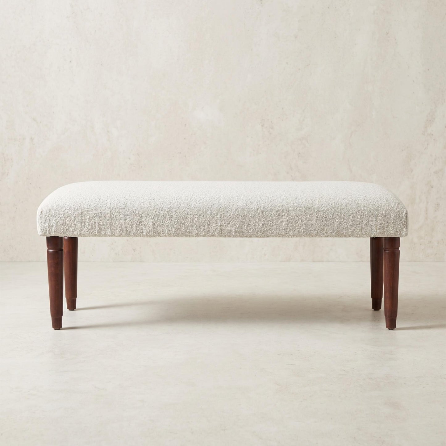 Cream boucle upholstered bench with mango wood legs from the Palisades fall collection