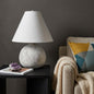 Palisades lamp styled on a console with books and decor