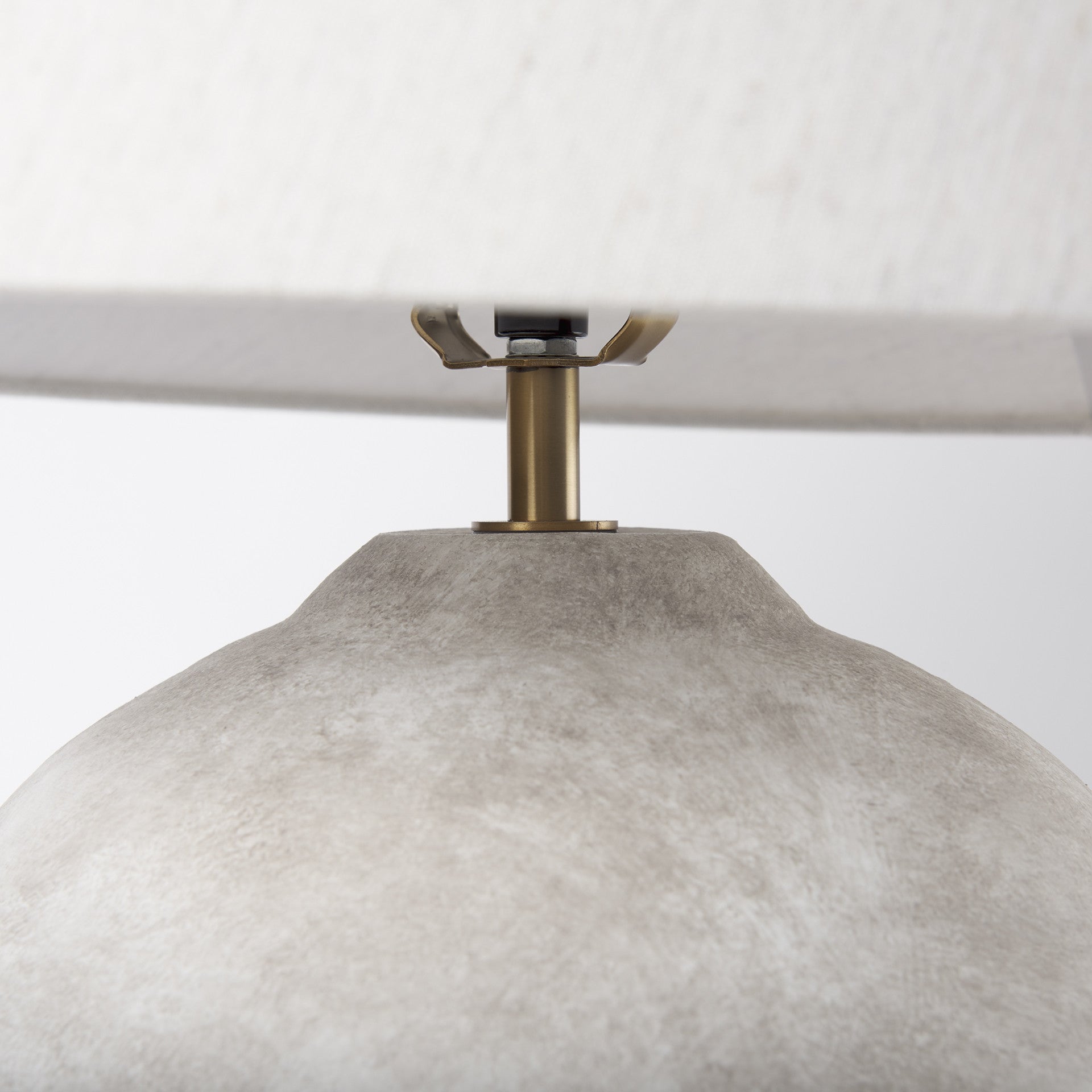 Base detail of the tan ceramic table lamp