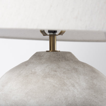 Base detail of the tan ceramic table lamp