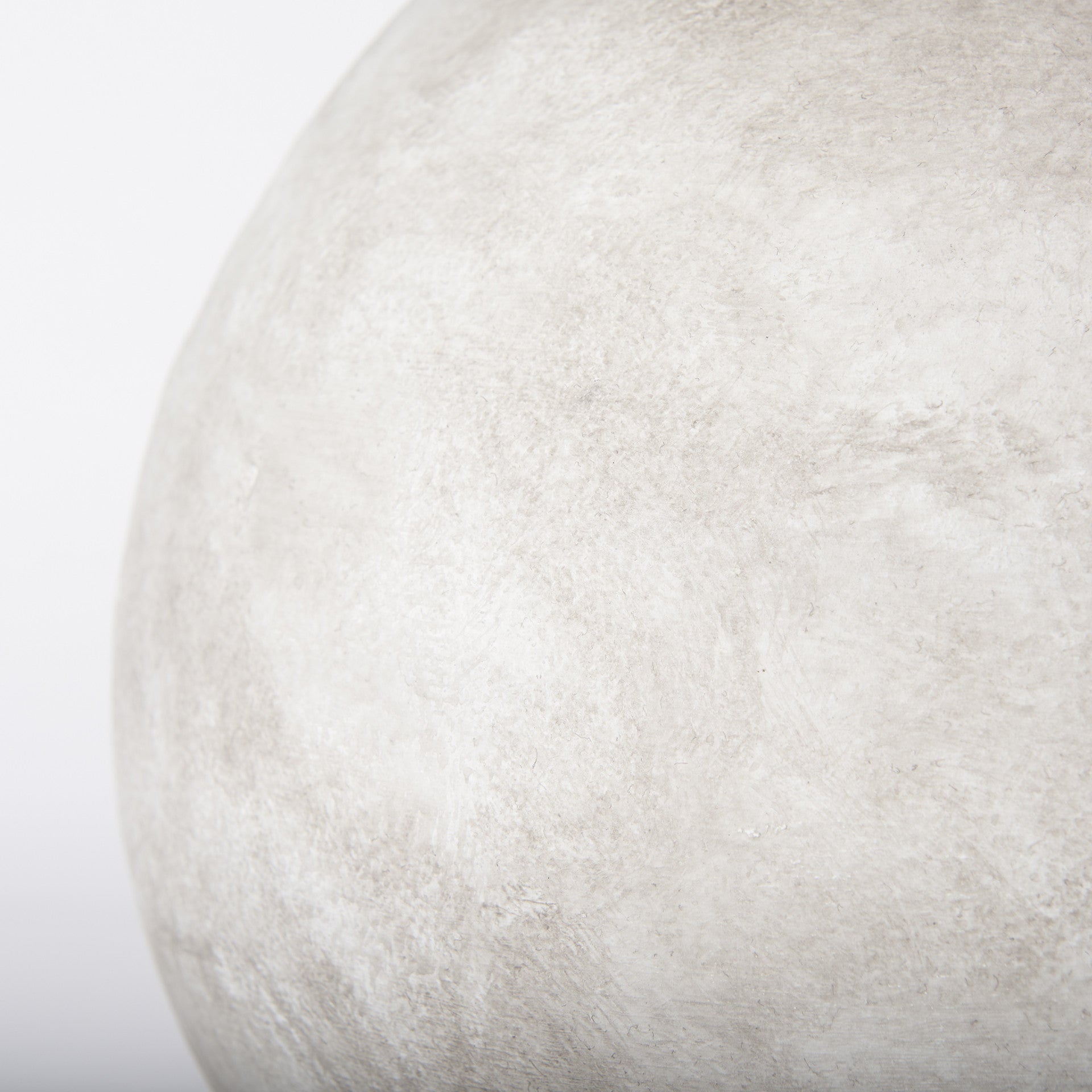 Base detail of the tan ceramic table lamp