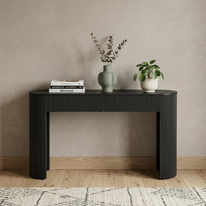 Palisades console table styled with vases and books in an entryway